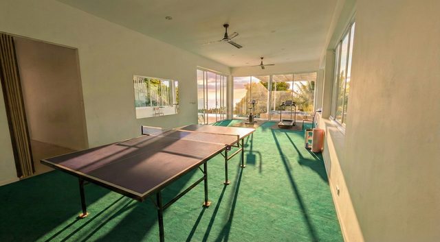 Games and fitness room with table tennis, treadmill and exercise equipment